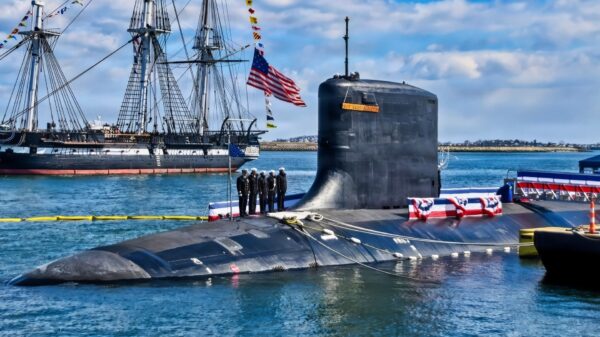 The USS Constitution sails past the Virginia-class nuclear-powered fast-attack submarine USS Massachusetts (SSN 798) during Massachusetts’ commissioning in Boston, on March 28th, 2026. Massachusetts is the newest fast-attack submarine and the fifth U.S. Navy vessel to bear the name. (U.S. Navy photo by Mass Communication Specialist 2nd Class Lucas J. Hastings)