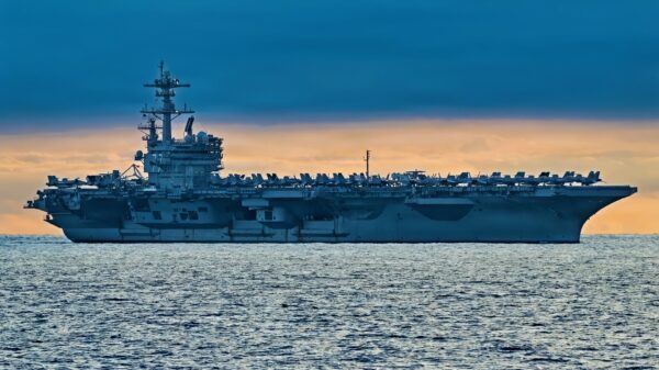 The Nimitz-class aircraft carrier USS George H.W. Bush (CVN 77) sails in formation while underway in the Atlantic Ocean, Dec. 10, 2025. The George H. W. Bush Carrier Strike Group is underway for Group Sail, its first integrated at-sea training phase. This event is designed to increase the Strike Group's tactical proficiency and lethality across all domains, meeting Navy and Joint warfighting requirements. (U.S. Navy photo by Mass Communication Specialist Seaman Mark Peña)