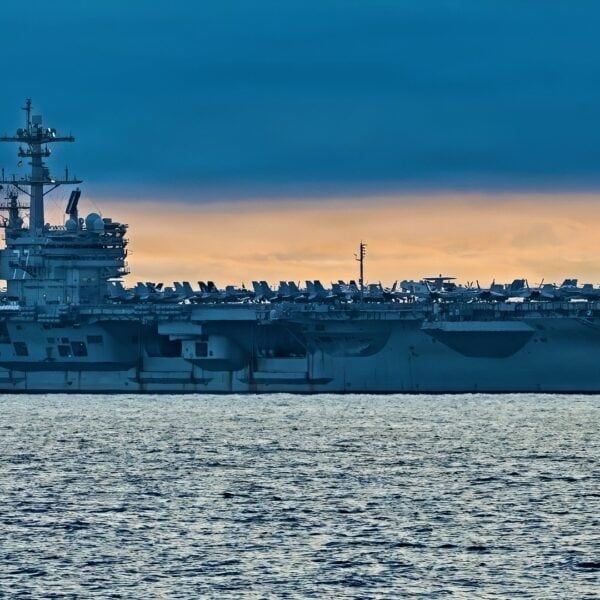The Nimitz-class aircraft carrier USS George H.W. Bush (CVN 77) sails in formation while underway in the Atlantic Ocean, Dec. 10, 2025. The George H. W. Bush Carrier Strike Group is underway for Group Sail, its first integrated at-sea training phase. This event is designed to increase the Strike Group's tactical proficiency and lethality across all domains, meeting Navy and Joint warfighting requirements. (U.S. Navy photo by Mass Communication Specialist Seaman Mark Peña)