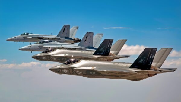 150903-N-SS390-354 FALLON, Nev. (Sept. 3, 2015) F-35C Lightning IIs, assigned to the Grim Reapers of Strike Fighter Squadron (VFA) 101, and an F/A-18E/F Super Hornets assigned to the Naval Aviation Warfighter Development Center (NAWDC) fly over Naval Air Station Fallon's (NASF) Range Training Complex. VFA 101, based out of Eglin Air Force Base, is conducting an F-35C cross-country visit to NASF. The purpose is to begin integration of F-35C with the Fallon Range Training Complex and work with NAWDC to refine tactics, techniques and procedures (TTP) of F-35C as it integrates into the carrier air wing. (U.S. Navy photo by Lt. Cmdr. Darin Russell/Released)