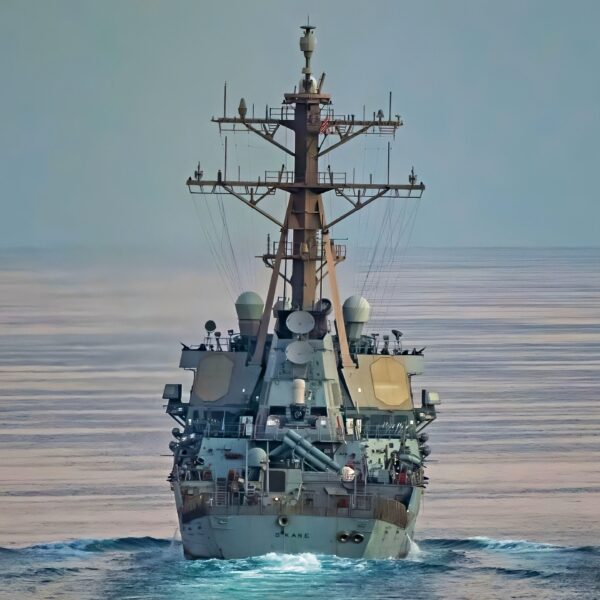 STRAIT OF HORMUZ (Nov. 12, 2021) Guided-missile destroyer USS O’Kane (DDG 77) performs a Strait of Hormuz transit with the amphibious assault ship USS Essex (LHD 2), Nov. 12. Essex and the 11th Marine Expeditionary Unit are deployed to the U.S. 5th Fleet area of operations in support of naval operations to ensure maritime stability and security in the Central Region, connecting the Mediterranean and the Pacific through the western Indian Ocean and three strategic choke points. (U.S. Navy photo by Mass Communication Specialist 1st Class Joe Rolfe)