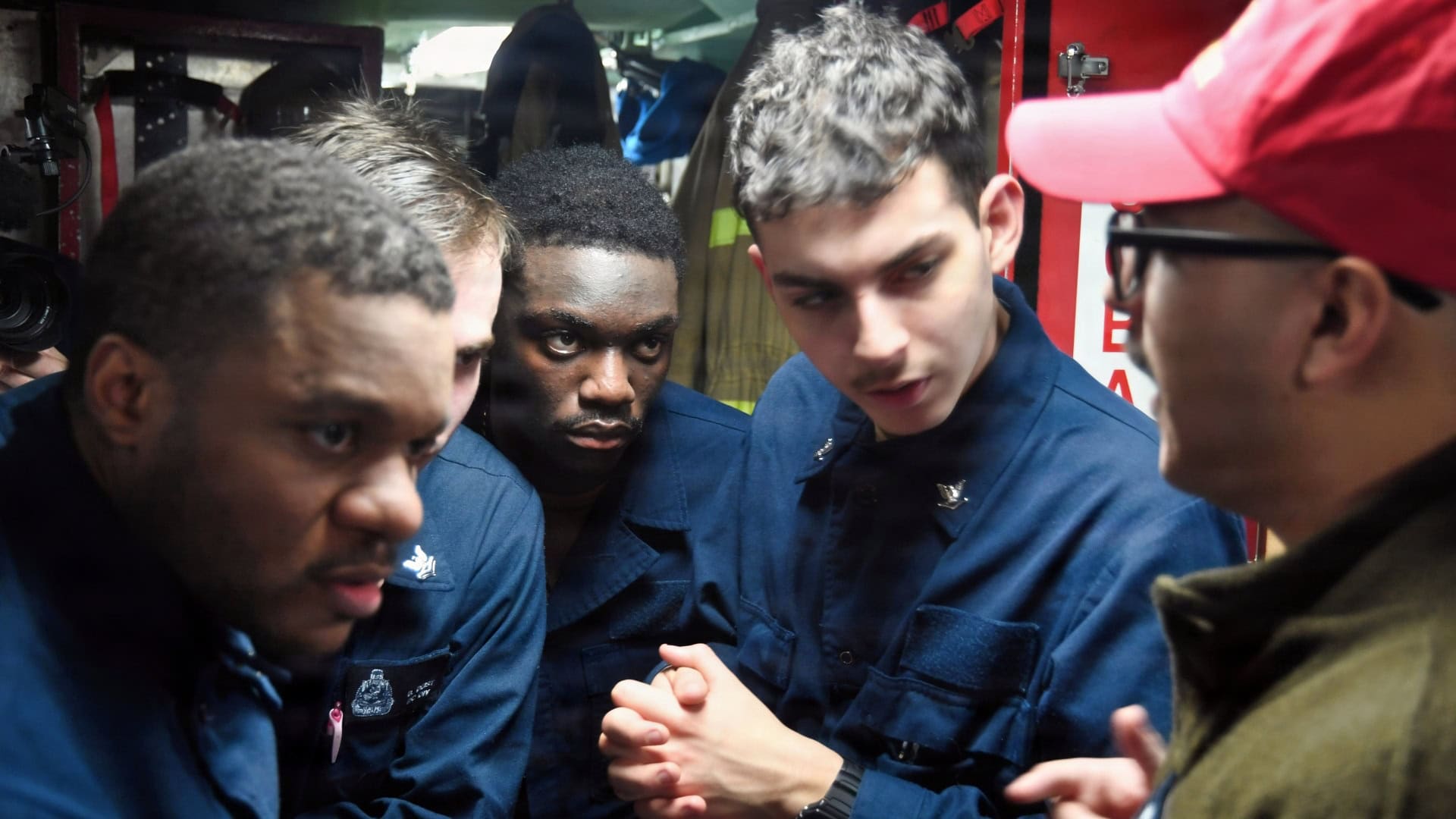 260321-N-ME988-1286 ARCTIC OCEAN (March 21, 2026) Machinist’s Mate (Nuclear) 1st Class Christian Garcia, right, assigned to the Virginia-class fast attack nuclear-powered submarine USS Delaware (SSN 791), provides feedback during a Crucible event to earn the Submarine Warfare qualification, commonly referred to as “fish,” while Delaware transits the Arctic Ocean, March 21, 2026. The Crucible event is the final stage in earning the Submarine Warfare qualification and consists of a question-and-answer board as well as damage control drills to demonstrate knowledge and skills learned. Delaware and crew operate under Submarine Squadron (SUBRON) 12 whose primary mission is to provide fast-attack submarines that are ready, prepared, and committed to meet the unique challenges of undersea combat and deployed operations in unforgiving environments across the globe. (U.S. Navy photo by Chief Mass Communication Specialist Darren M. Moore)