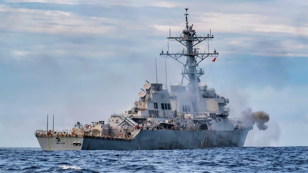 SOUTH CHINA SEA (Nov. 24, 2019) The mark 45 5 inch gun is fired from the forecastle of the Arleigh Burke-class guided-missile destroyer USS Milius (DDG 69) during a live-fire gunnery exercise. Milius is underway conducting operations in the Indo-Pacific region while assigned to Destroyer Squadron (DESRON) 15, the Navy’s largest forward-deployed DESRON and the U.S. 7th Fleet’s principal surface force. (U.S. Navy photo by Mass Communication Specialist 2nd Class Taylor DiMartino)