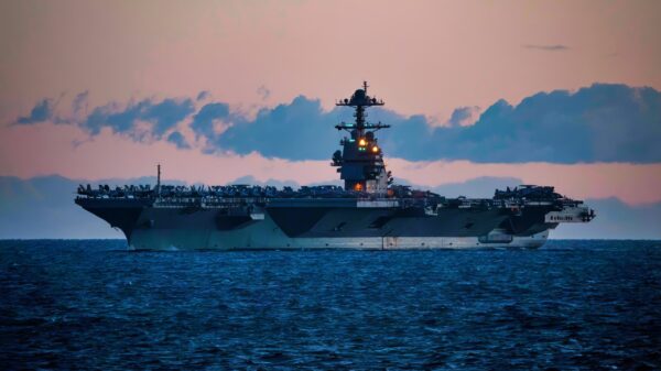 240105-N-LK647-1019 STRAIT OF GIBRALTAR (Jan. 5, 2024) A view from the Ticonderoga-class guided missile cruiser USS Normandy (CG 60) of the first-in-class aircraft carrier USS Gerald R. Ford (CVN 78), as the Ford Carrier Strike Group passes through the Strait of Gibraltar, Jan. 5, 2024. Normandy is part of the Gerald R. Ford Carrier Strike Group and is currently operating in the Mediterranean Sea, at the direction of the Secretary of Defense. The U.S. maintains forward-deployed, ready, and postured forces to deter aggression and support security and stability around the world. (U.S. Navy photo by Mass Communication Specialist 2nd Class Malachi Lakey)