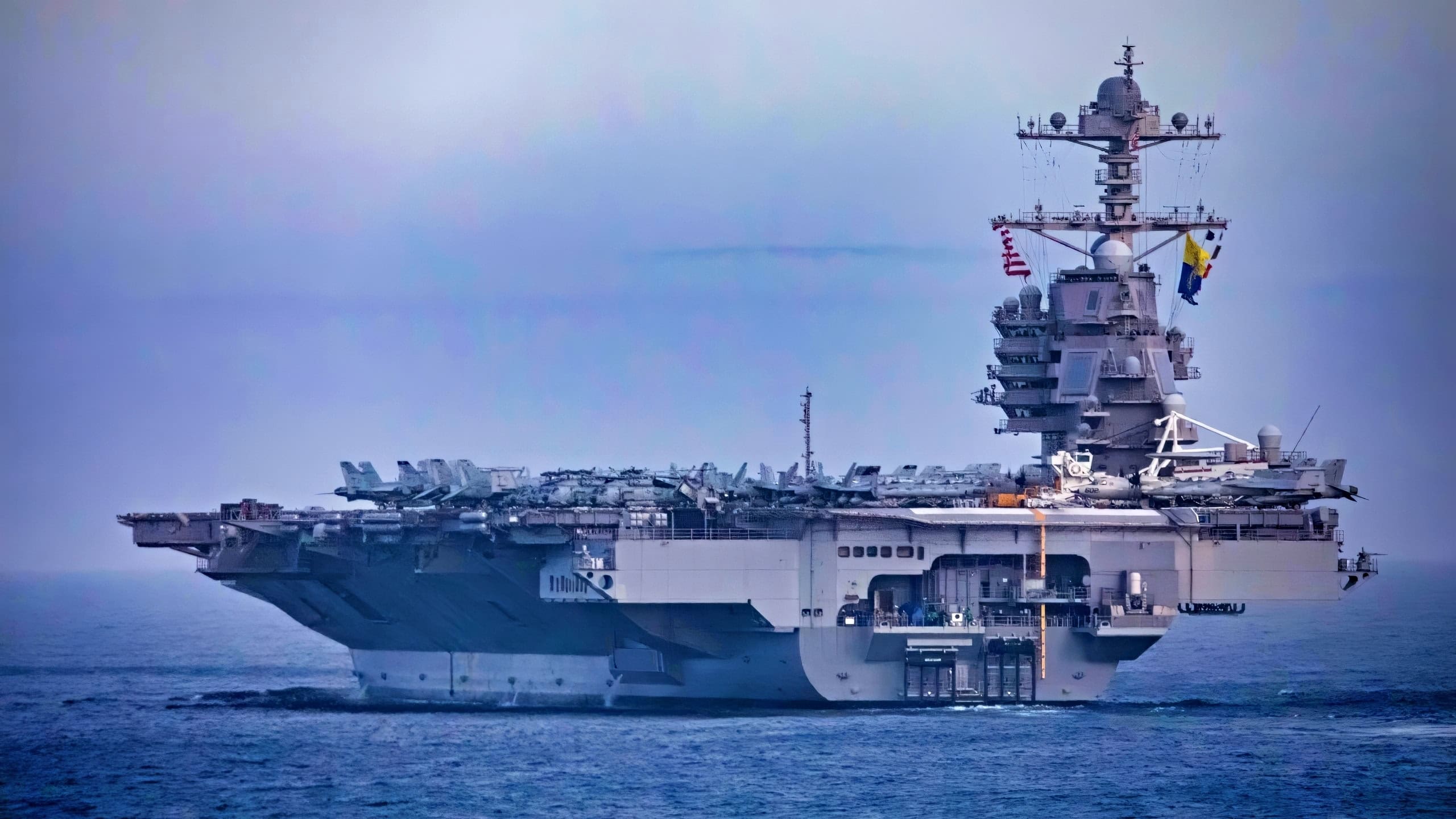 The first-in-class aircraft carrier USS Gerald R. Ford (CVN 78) steams in formation with the Gerald R. Ford Carrier Strike Group and other coalition warships during a formation transit, Oct. 25, 2022. Ford is on its inaugural deployment conducting training and operations alongside NATO Allies and partners to enhance integration for future operations and demonstrate the U.S. Navy’s commitment to a peaceful, stable and conflict free Atlantic region. (U.S. Navy photo by Mass Communication Specialist 2nd Class Sawyer Connally)