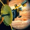 Artist's rendering of NASA's Galileo spacecraft flying past Jupiter's moon Io. Galileo made multiple close approaches to the volcanically active moon during its time at Jupiter, including a first pass in Dec. 1995, during its arrival in the Jupiter system.