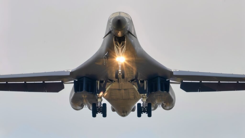 A U.S. Air Force B-1B Lancer assigned to the 345th Expeditionary Bomb Squadron, decends for landing at Ørland Air Base, Norway, during a Bomber Task Force Europe deployment, Aug. 9, 2025. The BTF mission highlights how we deliver effects rapidly across dynamic and contested environments through integrated training. (U.S. Air Force photo by Staff Sgt. Tambri Cason)