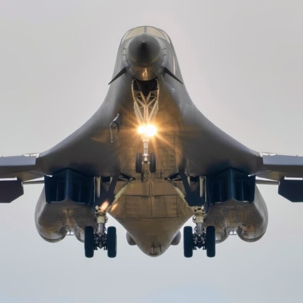 A U.S. Air Force B-1B Lancer assigned to the 345th Expeditionary Bomb Squadron, decends for landing at Ørland Air Base, Norway, during a Bomber Task Force Europe deployment, Aug. 9, 2025. The BTF mission highlights how we deliver effects rapidly across dynamic and contested environments through integrated training. (U.S. Air Force photo by Staff Sgt. Tambri Cason)