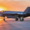 A U.S. Air Force F-35A Lightning II aircraft assigned to the 115th Fighter Wing, Wisconsin Air National Guard is parked on the ramp at sunrise during the 115th FW 2026 Combat Readiness Exercise, Operation Iron Orchid, at Volk Field Air National Guard Base, Camp Douglas, Wisconsin, June 26, 2026. Operation Iron Orchid is designed to assess and reinforce the wing’s ability to generate combat capability, sustain operations, protect personnel and resources, respond to evolving conditions, and execute mission-essential tasks in a realistic and challenging environment. (U.S. Air National Guard photo by Master Sgt. Mary Greenwood)