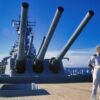 Crew members man the rail as the battleship USS MISSOURI (BB 63) arrives in port prior to a cruise to Australia and around the world.