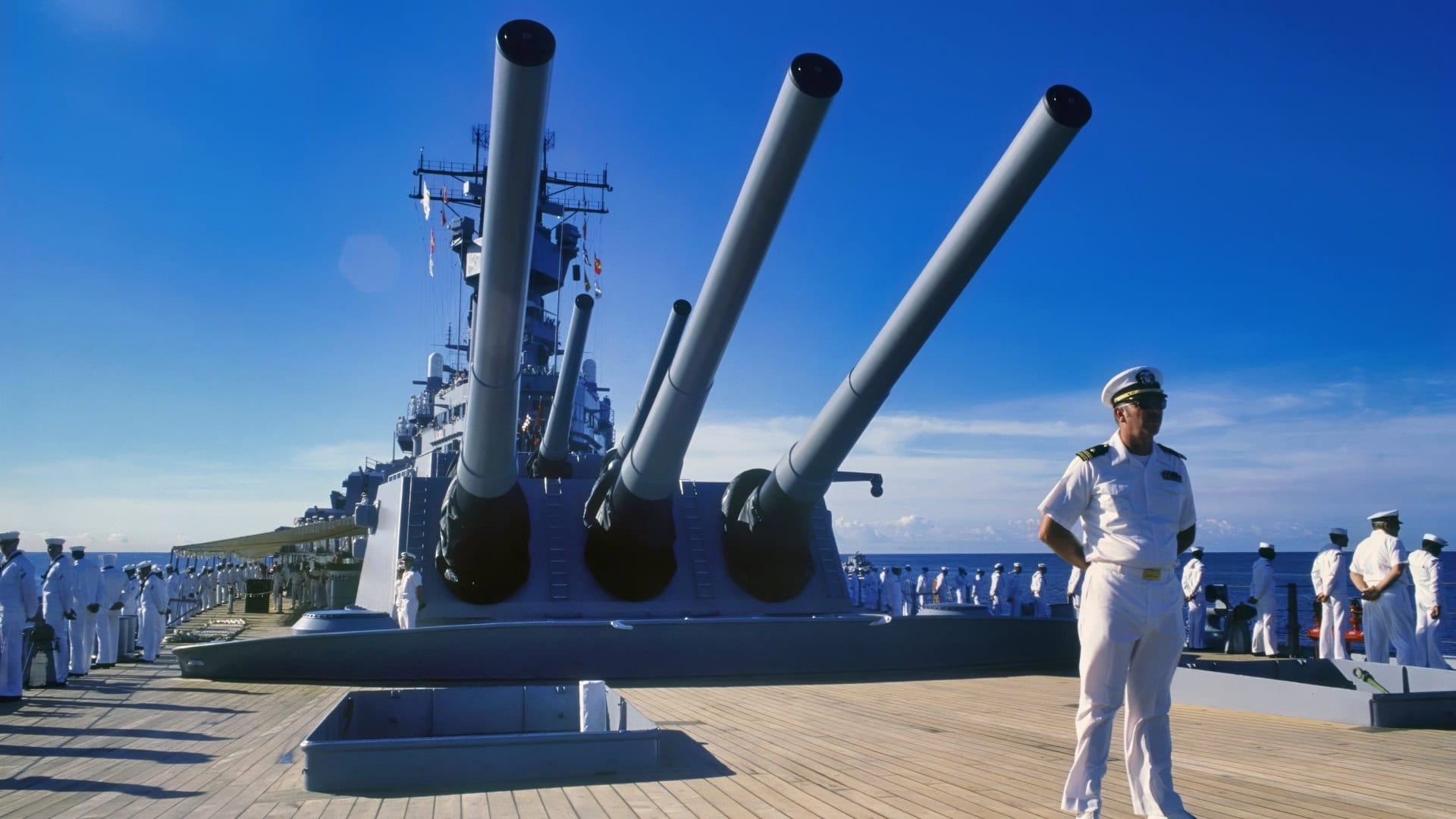 Crew members man the rail as the battleship USS MISSOURI (BB 63) arrives in port prior to a cruise to Australia and around the world.