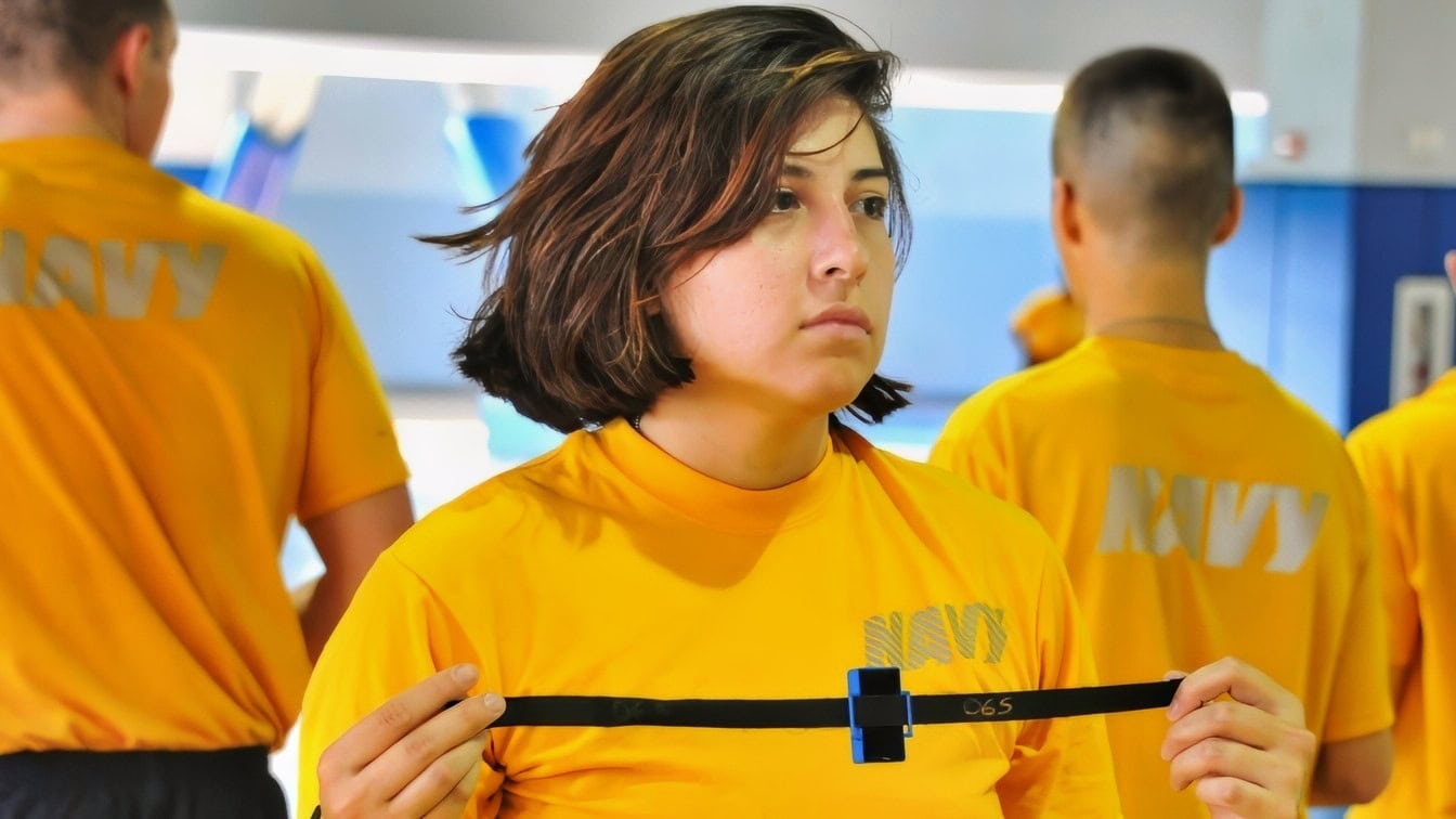 (Nov. 16, 2016) A recruit from Division 902 stands by for final results on her Physical Fitness Assessment and running chip verification that electronically tracks their 1.5-mile run on Nov. 16 at Recruit Training Command. The final PFA is the third physical test administered to recruits and is their official assessment that determines their eligibility for graduation. About 38,000 recruits graduate annually from the Navy’s only boot camp. (U.S. Navy photo by Chief Petty Officer Seth Schaeffer/Released)