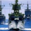 A bow view of the ships composing the battleship USS MISSOURI (BB-63) battle group participating in the multinational Exercise RIMPAC '88. They are, front to back: the frigate USS COOK (FF-1083), the guided missile frigate USS MCCLUSKY (FFG-41), the destroyer USS JOHN YOUNG (DD-973) and the nuclear-powered guided missile cruiser USS LONG BEACH (CGN-9).