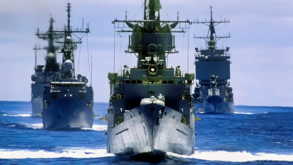 A bow view of the ships composing the battleship USS MISSOURI (BB-63) battle group participating in the multinational Exercise RIMPAC '88. They are, front to back: the frigate USS COOK (FF-1083), the guided missile frigate USS MCCLUSKY (FFG-41), the destroyer USS JOHN YOUNG (DD-973) and the nuclear-powered guided missile cruiser USS LONG BEACH (CGN-9).