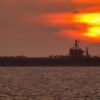 The Nimitz-class aircraft carrier USS Theodore Roosevelt (CVN 71) underway at sunset in the Persian Gulf. Roosevelt and embarked Carrier Air Wing Eight (CVW-8) are currently on a regularly scheduled deployment conducting maritime security operations. U.S. Navy Photo by Photographer’s Mate 2nd Class Matthew Bash (RELEASED)