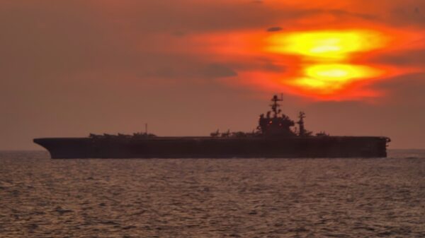 The Nimitz-class aircraft carrier USS Theodore Roosevelt (CVN 71) underway at sunset in the Persian Gulf. Roosevelt and embarked Carrier Air Wing Eight (CVW-8) are currently on a regularly scheduled deployment conducting maritime security operations. U.S. Navy Photo by Photographer’s Mate 2nd Class Matthew Bash (RELEASED)