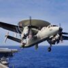 ABOARD USS KITTY HAWK (CV 63) AT SEA (May 22, 2004) -- An E-2C Hawkeye assigned to Airborne Early Warning Squadron (VAW) 115 "Liberty Bells" banks after being launched from USS Kitty Hawk (CV 63) following the ship's annual spring cruise. The E-2C is all weather, carrier-based tactical warning/control system aircraft, providing airborne early warning and control functions for the strike group. Currently under way in the 7th Fleet area of responsibility (AOR), Kitty Hawk demonstrates power projection and sea control as the world's only permanently forward-deployed aircraft carrier, operating from Yokosuka, Japan.