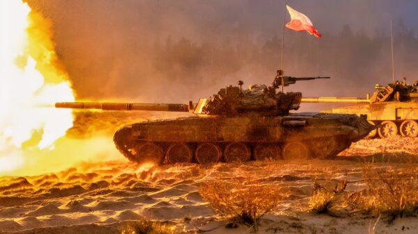 A Polish tank fires during the Iron Spear exercise in Adazi, Latvia, Nov. 13, 2023. U.S. Army Soldiers with Bravo Company, 2nd Battalion, 69th Armored Regiment “Panther Battalion”, 2nd Armored Brigade Combat Team, 3rd Infantry Division supporting NATO’s enhanced Forward Presence Battle Group Poland, joined multinational troops from Canada, Germany, Italy, Latvia, Lithuania, the Netherlands, Spain, and the United Kingdom representing NATO enhanced Forward Presence Battle Groups from Latvia, Lithuania, Estonia, and Poland for the exercise. The 3rd Infantry Division’s mission in Europe is to engage in multinational training and exercises across the continent, working alongside NATO allies and regional security partners to provide combat-credible forces to V Corps, America’s forward deployed corps in Europe. (U.S. Army photo by Capt. H Howey)