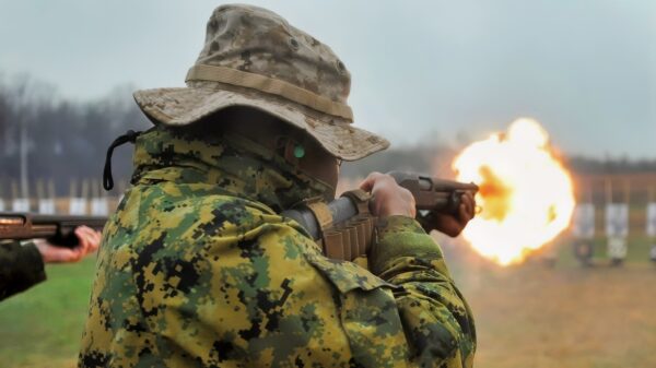 A U.S. Marine with Marine Corps Embassy Security Group (MCESG) Class 3-14, engages the target with a Remington 870 12 gauge pump action Shotgun as a part of training qualifications to graduate as a Marine Corps Embassy Security Guard at Weapons Training Battalion, Marine Corps Base Quantico, Va., April 7, 2014. Every student must qualify with the M9 Beretta and Remington 870 Shotgun to graduate MCESG. (U.S. Marine Corps photo by Lance Cpl. Samuel Fernandez/Released)