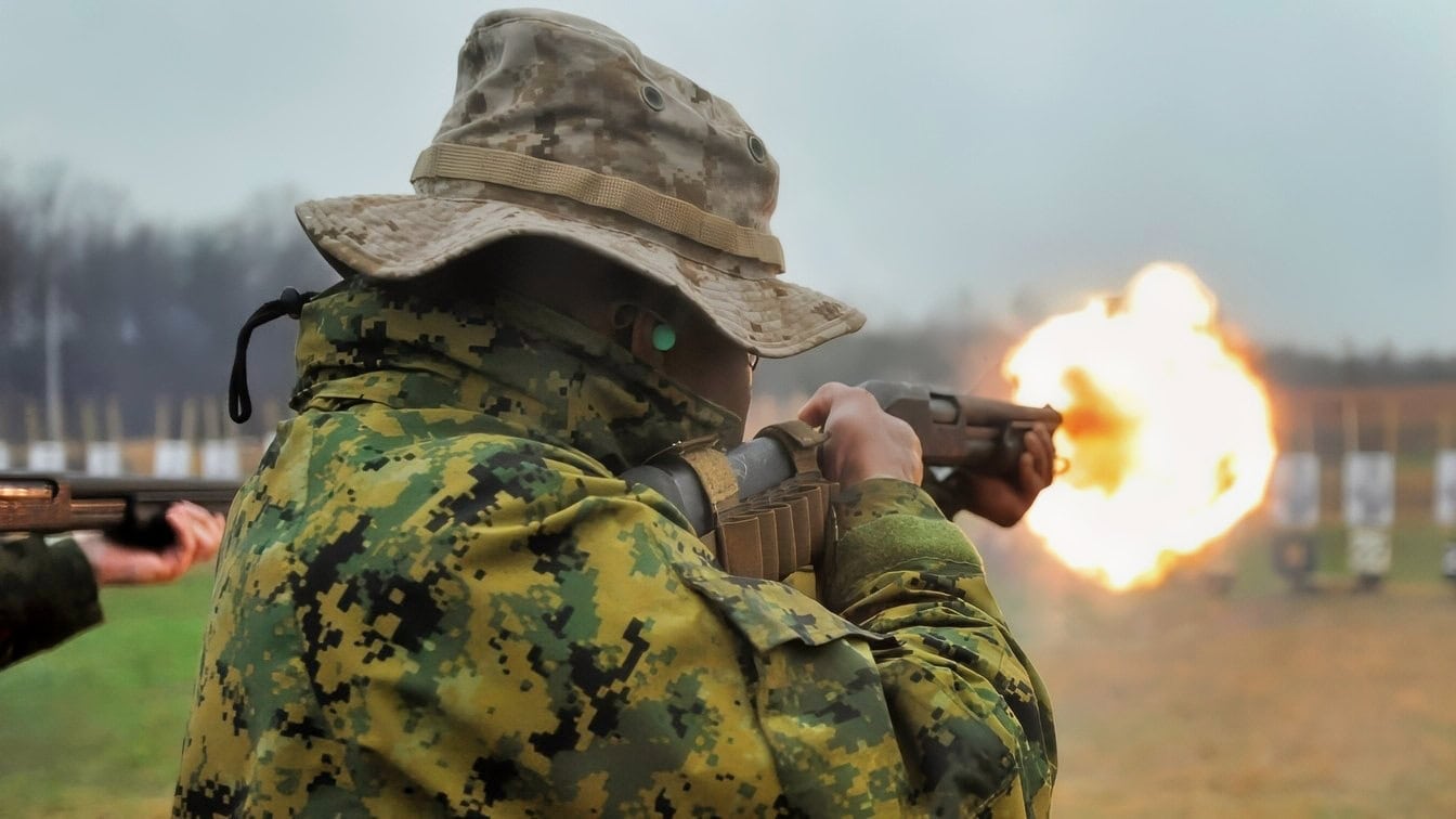 A U.S. Marine with Marine Corps Embassy Security Group (MCESG) Class 3-14, engages the target with a Remington 870 12 gauge pump action Shotgun as a part of training qualifications to graduate as a Marine Corps Embassy Security Guard at Weapons Training Battalion, Marine Corps Base Quantico, Va., April 7, 2014. Every student must qualify with the M9 Beretta and Remington 870 Shotgun to graduate MCESG. (U.S. Marine Corps photo by Lance Cpl. Samuel Fernandez/Released)
