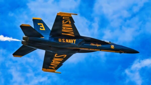 A U.S. Navy Blue Angel F/A-18A Super Hornet flies overhead in preparation for their performance at the Naval Air Station (NAS) Patuxent River Air Show on Naval Air Station Patuxent River, June 19, 2026. (U.S. Navy photo by Mass Communication Specialist 2nd Class John T. Jarrett)