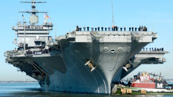 Naval Station Norfolk, Va. (Feb. 29, 2004) - The crew "mans the rails" aboard the nuclear powered aircraft carrier USS Enterprise (CVN 65) as she approaches pier 12 where thousands of family members await. The carrier completed a six-month deployment in support of the global war on terrorism. U.S. Navy photo by Chief Journalist (SW/AW) Dave Fliesen, Fleet Combat Camera, Atlantic. (RELEASED)