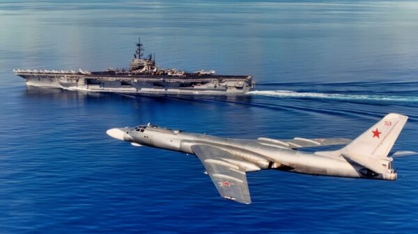 US Navy Aircraft Carrier and Russian Tu-16 Bomber