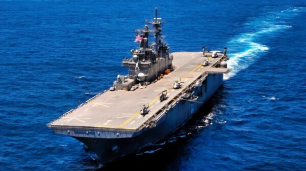 The amphibious assault ship USS Wasp (LHD 1) transits ahead while 15 coalition partner ships break away from formation during a sailing event while participating in the War of 1812 fleet exercise. The exercise is a week-long multi-national exercise involving 19 ships from the United States, Canada, the United Kingdom, Germany, Norway, Denmark, Brazil, and Portugal, and is designed to increase interoperability with allied nations, improve tactical prowess and certification of participating units. (U.S. Navy photo by Mass Communication Specialist Petty Officer 2nd Class Gretchen M. Albrecht)