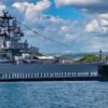 PEARL HARBOR, Hawaii (January 26, 2018) The crew of the Virginia-class fast-attack submarine USS Missouri (SSN 780) render honors to the Battleship Missouri Memorial following a homeport change from Groton, Connecticut. (U.S. Navy photo by Mass Communication Specialist 2nd Class Michael H. Lee/ Released)