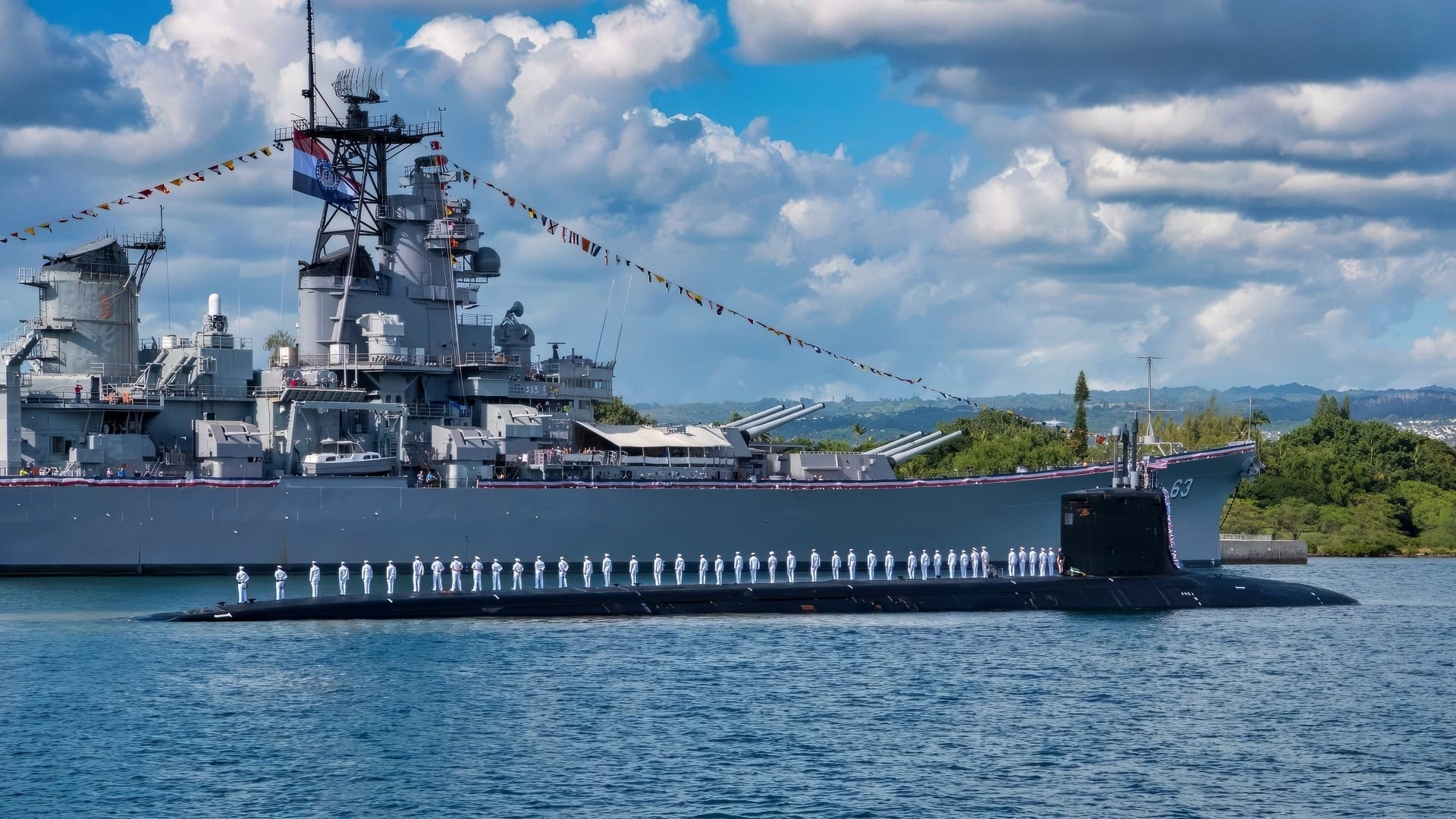 PEARL HARBOR, Hawaii (January 26, 2018) The crew of the Virginia-class fast-attack submarine USS Missouri (SSN 780) render honors to the Battleship Missouri Memorial following a homeport change from Groton, Connecticut. (U.S. Navy photo by Mass Communication Specialist 2nd Class Michael H. Lee/ Released)