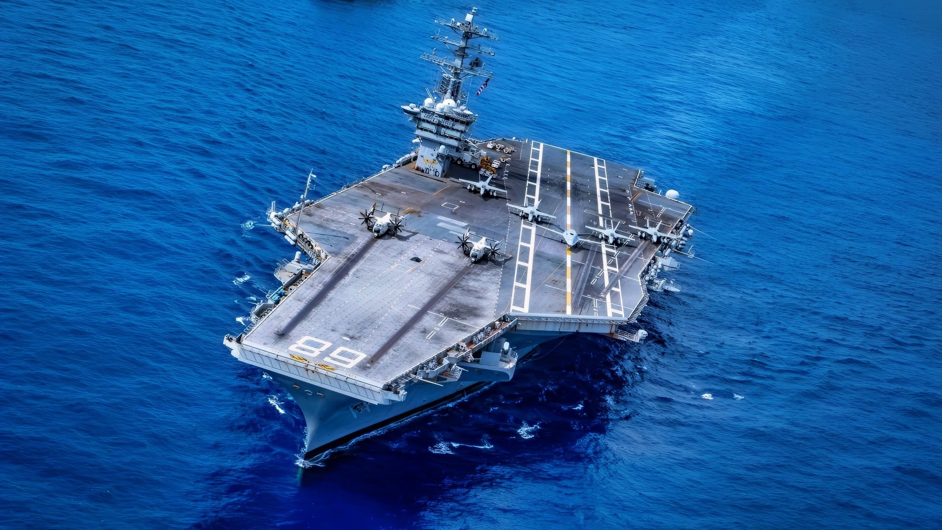 Twenty-six ships from 13 partner and allied nations steam in formation with Nimitz-class aircraft carrier USS Nimitz (CVN 68) as part of Fleet Exercise (FLEETEX) 250 in the Atlantic Ocean, June 25, 2026. Nimitz is underway taking part in Fleet Exercise (FLEETEX) 250, a series of structured multilateral training events at-sea, aimed at building cohesiveness, validating tactical procedures, and strengthening the interoperability of participating units—which include warships, aircraft, and crews from the U.S. and 13 partner and allied nations. (U.S. Navy photo by Mass Communication Specialist 3rd Class Gina M. Gallia)