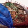 Apra Harbor, Guam (Jan. 27, 2005) – The Los Angeles-class fast-attack submarine USS San Francisco (SSN 711) in dry dock to assess damage sustained after running aground approximately 350 miles south of Guam Jan. 8, 2005. . The Navy former dry dock known as “Big Blue” is capable of docking ships that weigh up to 40,000 Long Tons. The Navy certified Big Blue for the one-time docking of San Francisco. San Francisco is the second fast-attack submarine to be attached to the forward-deployed Submarine Squadron Fifteen, home ported on board Naval Base Guam. U.S. Navy photo by Photographer's Mate 2nd Class Mark Allen Leonesio (RELEASED)