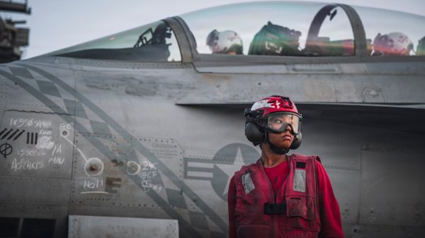 A U.S. Sailor checks ordnance on an F/A-18 Super Hornet, attached to Strike Fighter Squadron (VFA) 102, on the flight deck of Nimitz-class aircraft carrier USS George Washington (CVN 73), Sept. 13, 2026. George Washington is deployed to the U.S. 5th Fleet area of operations to support maritime security and stability in the Middle East. (U.S. Navy photo)