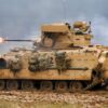 A U.S. Army M2 Bradley Fighting Vehicle assigned to the 1st Battalion, 16th Infantry Regiment, 1st Armored Brigade Combat Team, 1st Infantry Division, engages targets during a combined arms live fire exercise on Novo Selo Training Area, Bulgaria, Jan. 24, 2026. Execution of the combined arms live-fire training exercise increased overall lethality and warfighting readiness along NATO's Eastern Flank by training units to shoot, move, and communicate effectively in complex operational environments. (U.S. Army Photo by Sgt. Adel Pacheco Alvarez)