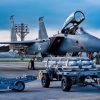 U.S. Air Force Airmen assigned to the 67th Fighter Generation Squadron prepare to load munitions onto a U.S. Air Force F-15EX Eagle II assigned to the 85th Test and Evaluation Squadron, Eglin Air Force Base, Florida, at Kadena Air Base, Japan, July 8, 2026. Airmen from the 67th Fighter Generation Squadron trained alongside the 85th TES gaining hands-on experience loading munitions on the F-15EX Eagle II and F-15E Strike Eagle while supporting test and evaluation operations. (U.S. Air Force photo by Airman 1st Class Gracelyn Hess)