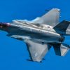 U.S. Air Force pilot Col. Michael 'Shot' Glass, 104th Fighter Wing Commander, flies an F-35A Lightning II over Barnes Air National Guard Base at exactly 1:04PM EST, officially marking the historic first arrival of the fifth-generation fighter aircraft to the Wing, June 11, 2026.