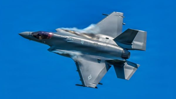 U.S. Air Force pilot Col. Michael 'Shot' Glass, 104th Fighter Wing Commander, flies an F-35A Lightning II over Barnes Air National Guard Base at exactly 1:04PM EST, officially marking the historic first arrival of the fifth-generation fighter aircraft to the Wing, June 11, 2026.