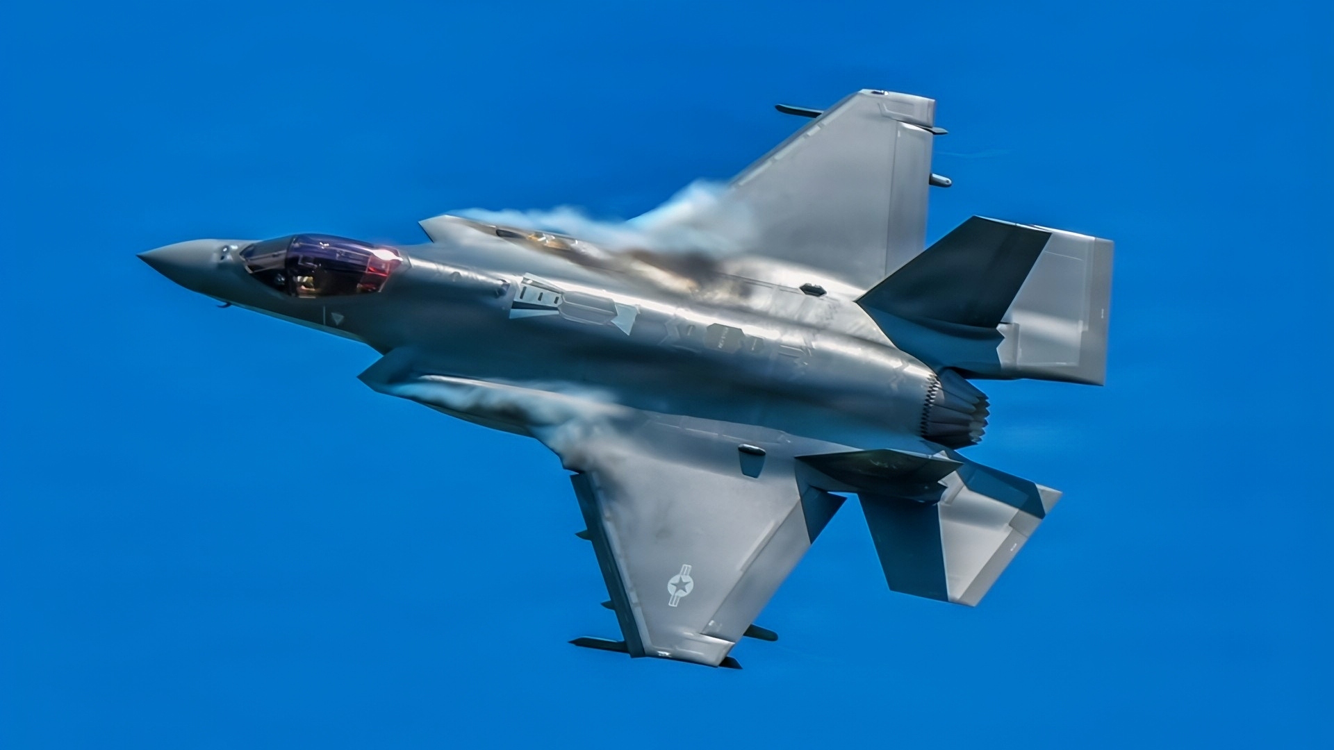 U.S. Air Force pilot Col. Michael 'Shot' Glass, 104th Fighter Wing Commander, flies an F-35A Lightning II over Barnes Air National Guard Base at exactly 1:04PM EST, officially marking the historic first arrival of the fifth-generation fighter aircraft to the Wing, June 11, 2026.