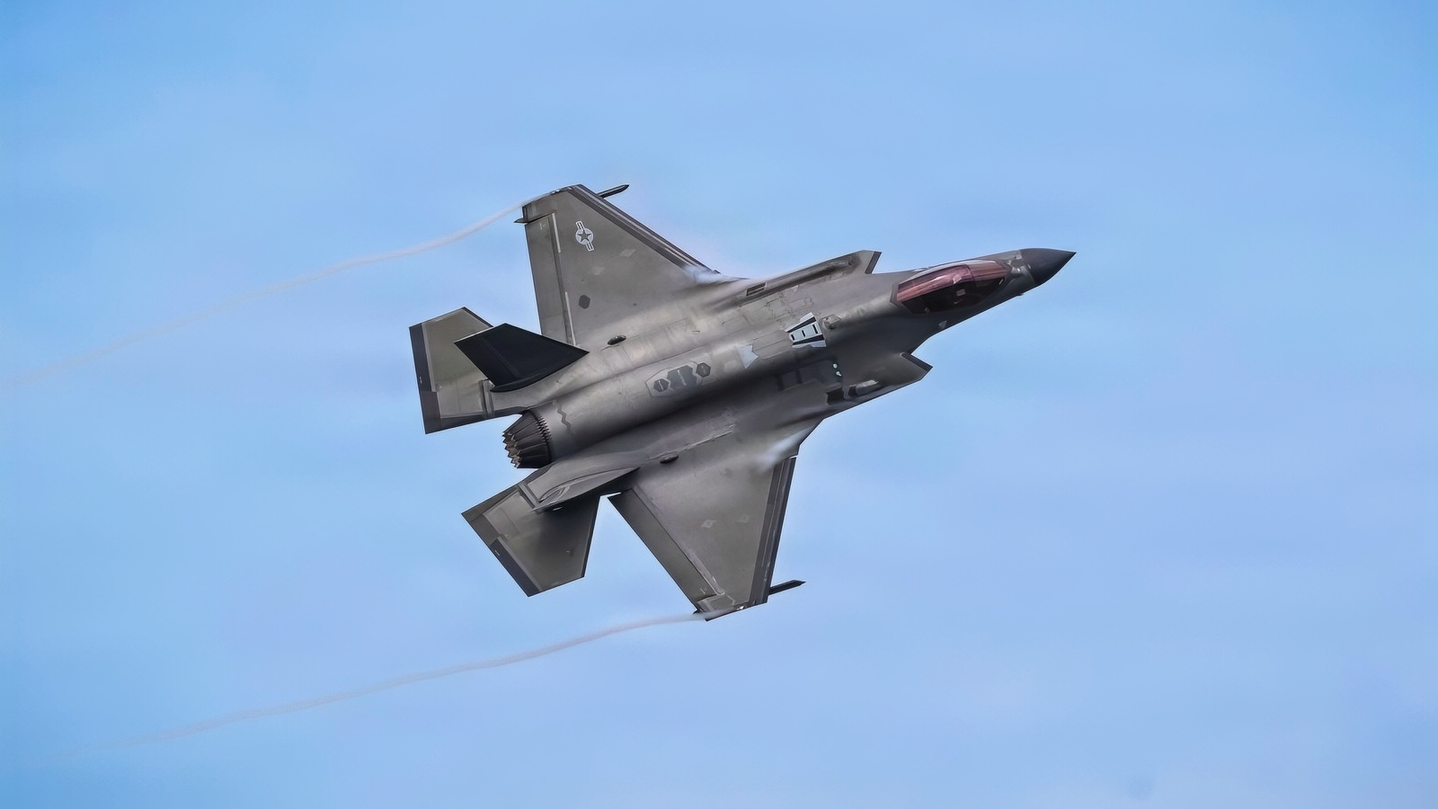 U.S. Air Force Lt. Col. Alexander Turner, 33rd Fighter Wing director of staff, soars over the flight line in an F-35A Lightning II at Eglin Air Force Base, Florida, June 26, 2026. The F-35A Lightning II is a fifth-generation aircraft combining stealth and sensor fusion to increase combat capability for executing the mission. (U.S. Air Force photo by Senior Airman Reagan Hardy)
