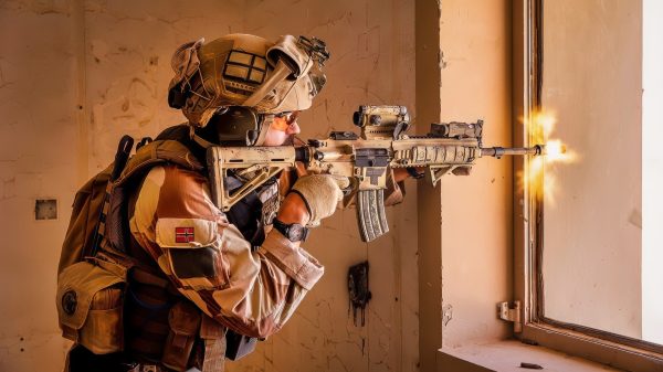 A Norwegian soldier of the Telemark Battalion, fires the HK416 with blank rounds toward a simulated target at Al Asad Air Base, Iraq, June 13, 2020. Coalition forces’ training is used to enhance base defense operations to provide better security in Iraq. (U.S. Army photo by Spc. Derek Mustard)