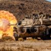 U.S. Soldiers assigned to 1st Battalion, 9th Cavalry Regiment, 2nd Armored Brigade Combat Team, 1st Cavalry Division fire an M1 Abrams main battle tank at an enemy target during Rotation 25-02 at the National Training Center, Fort Irwin, Calif., Nov. 07, 2024. Rotations at the National Training Center ensure Army Brigade Combat Teams remain versatile, responsive, and consistently available for current and future contingencies. (U.S. Army photo by Spc. Casey Auman, Operations Group, National Training Center).