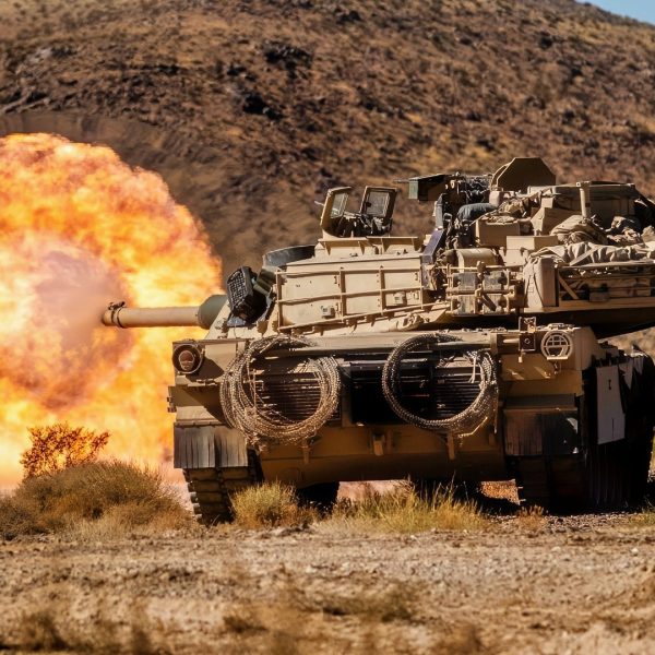 U.S. Soldiers assigned to 1st Battalion, 9th Cavalry Regiment, 2nd Armored Brigade Combat Team, 1st Cavalry Division fire an M1 Abrams main battle tank at an enemy target during Rotation 25-02 at the National Training Center, Fort Irwin, Calif., Nov. 07, 2024. Rotations at the National Training Center ensure Army Brigade Combat Teams remain versatile, responsive, and consistently available for current and future contingencies. (U.S. Army photo by Spc. Casey Auman, Operations Group, National Training Center).