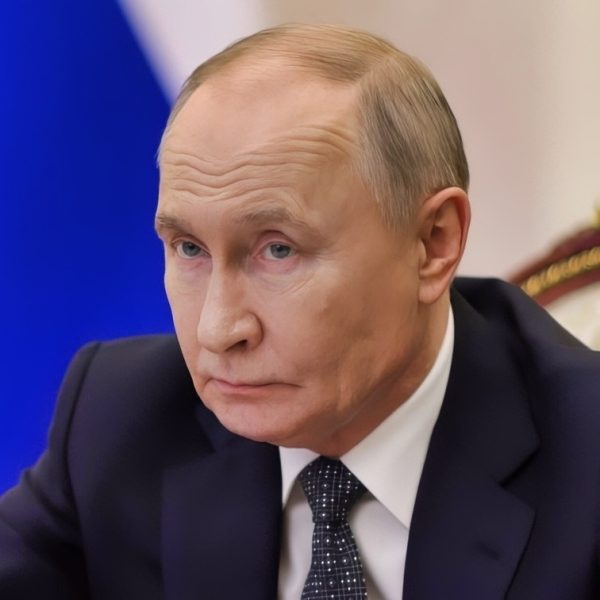 Putin Back in March of 2025 at Desk Creative Commons