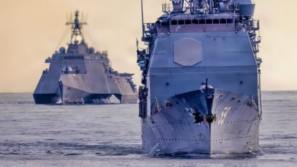 Ticonderoga-class guided missile cruiser USS Princeton (CG 59), front, and Independence-class littoral combat ship USS Kansas City (LCS 22), conduct a simulated strait transit in the Pacific Ocean, Jan. 27, 2026. The simulated strait transit was conducted to refine the 11th MEU’s ability to integrate with the Navy for enhanced force protection. The 11th Marine Expeditionary Unit is currently underway aboard the Boxer Amphibious Ready Group in the U.S. 3rd Fleet area of operations conducting integrated training that enhances lethality and warfighting readiness. (U.S. Marine Corps photo by Sgt. Trent A. Henry)