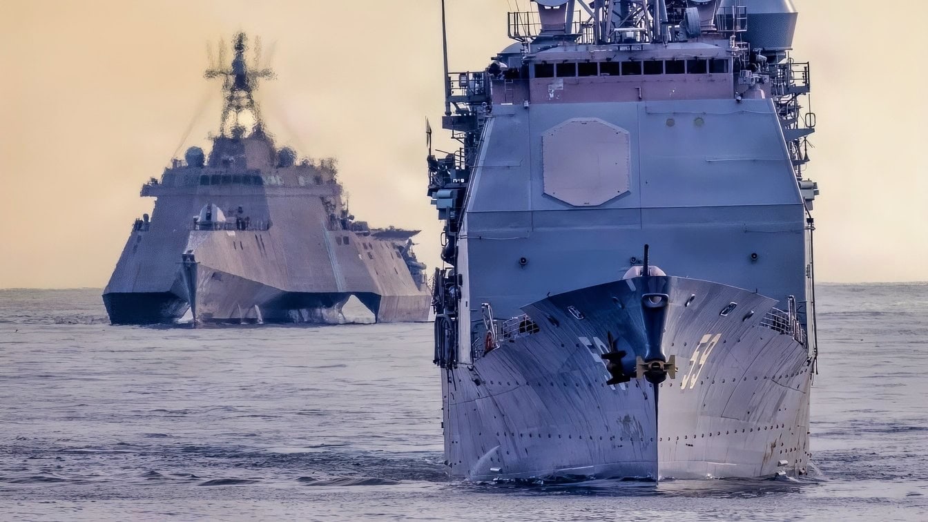 Ticonderoga-class guided missile cruiser USS Princeton (CG 59), front, and Independence-class littoral combat ship USS Kansas City (LCS 22), conduct a simulated strait transit in the Pacific Ocean, Jan. 27, 2026. The simulated strait transit was conducted to refine the 11th MEU’s ability to integrate with the Navy for enhanced force protection. The 11th Marine Expeditionary Unit is currently underway aboard the Boxer Amphibious Ready Group in the U.S. 3rd Fleet area of operations conducting integrated training that enhances lethality and warfighting readiness. (U.S. Marine Corps photo by Sgt. Trent A. Henry)