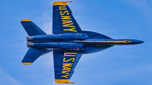 An F/A-18 Super Hornet aircraft with the U.S. Navy flight demonstration squadron, the Blue Angels, executes a high-speed pass during the Arctic Thunder Open House at Joint Base Elmendorf-Richardson, Alaska, Aug. 8, 2026. The Blue Angels connect the American people to the quiet professionalism, technical mastery and unwavering resolve of the Navy–Marine Corps teams. (U.S. Navy photo by Mass Communication Specialist 2nd Class David Rowe)