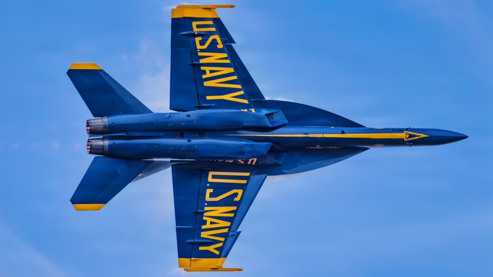 An F/A-18 Super Hornet aircraft with the U.S. Navy flight demonstration squadron, the Blue Angels, executes a high-speed pass during the Arctic Thunder Open House at Joint Base Elmendorf-Richardson, Alaska, Aug. 8, 2026. The Blue Angels connect the American people to the quiet professionalism, technical mastery and unwavering resolve of the Navy–Marine Corps teams. (U.S. Navy photo by Mass Communication Specialist 2nd Class David Rowe)
