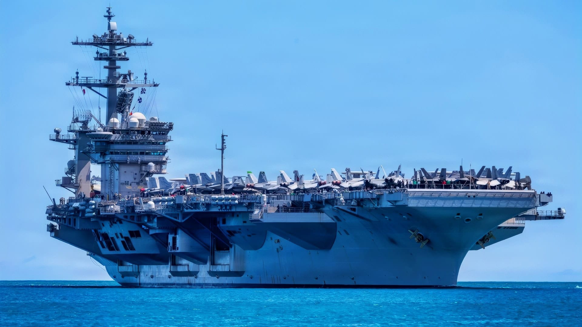 Nimitz-class aircraft carrier USS Theodore Roosevelt (CVN 71) returns to Joint Base Pearl Harbor-Hickam to participate in the final events of Exercise Rim of the Pacific 2026, July 28, 2026. Thirty nations, 30 ships, five submarines, 15 national land forces, more than 190 aircraft and more than 30,000 personnel are participating in RIMPAC in and around the Hawaiian Islands, June 24 to July 31. The world's largest international maritime exercise, RIMPAC provides a unique training opportunity while fostering and sustaining cooperative relationships among participants critical to ensuring the safety of sea lanes and security on the world's oceans. RIMPAC 2026 is the 30th exercise in the series that began in 1971. (U.S. Navy photo by Mass Communication Specialist Seaman Mark Bergado)