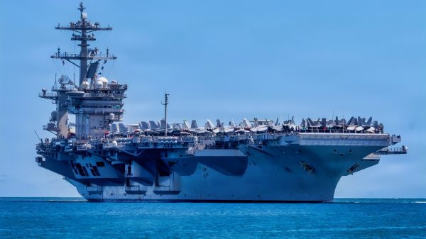 Nimitz-class aircraft carrier USS Theodore Roosevelt (CVN 71) returns to Joint Base Pearl Harbor-Hickam to participate in the final events of Exercise Rim of the Pacific 2026, July 28, 2026. Thirty nations, 30 ships, five submarines, 15 national land forces, more than 190 aircraft and more than 30,000 personnel are participating in RIMPAC in and around the Hawaiian Islands, June 24 to July 31. The world's largest international maritime exercise, RIMPAC provides a unique training opportunity while fostering and sustaining cooperative relationships among participants critical to ensuring the safety of sea lanes and security on the world's oceans. RIMPAC 2026 is the 30th exercise in the series that began in 1971. (U.S. Navy photo by Mass Communication Specialist Seaman Mark Bergado)