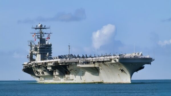 Pearl Harbor, Hawaii (Apr. 26, 2003) -- Spectators welcome the aircraft carrier, USS Abraham Lincoln (CVN 72) to Pearl Harbor. Lincoln is on its way home from a deployment spanning more than nine months. Abraham Lincoln is among the first ships to return home from Operation Iraqi Freedom. U.S. Navy photo by PhotographerÕs Mate 2nd Class Joshua L. Pritekel. (RELEASED)